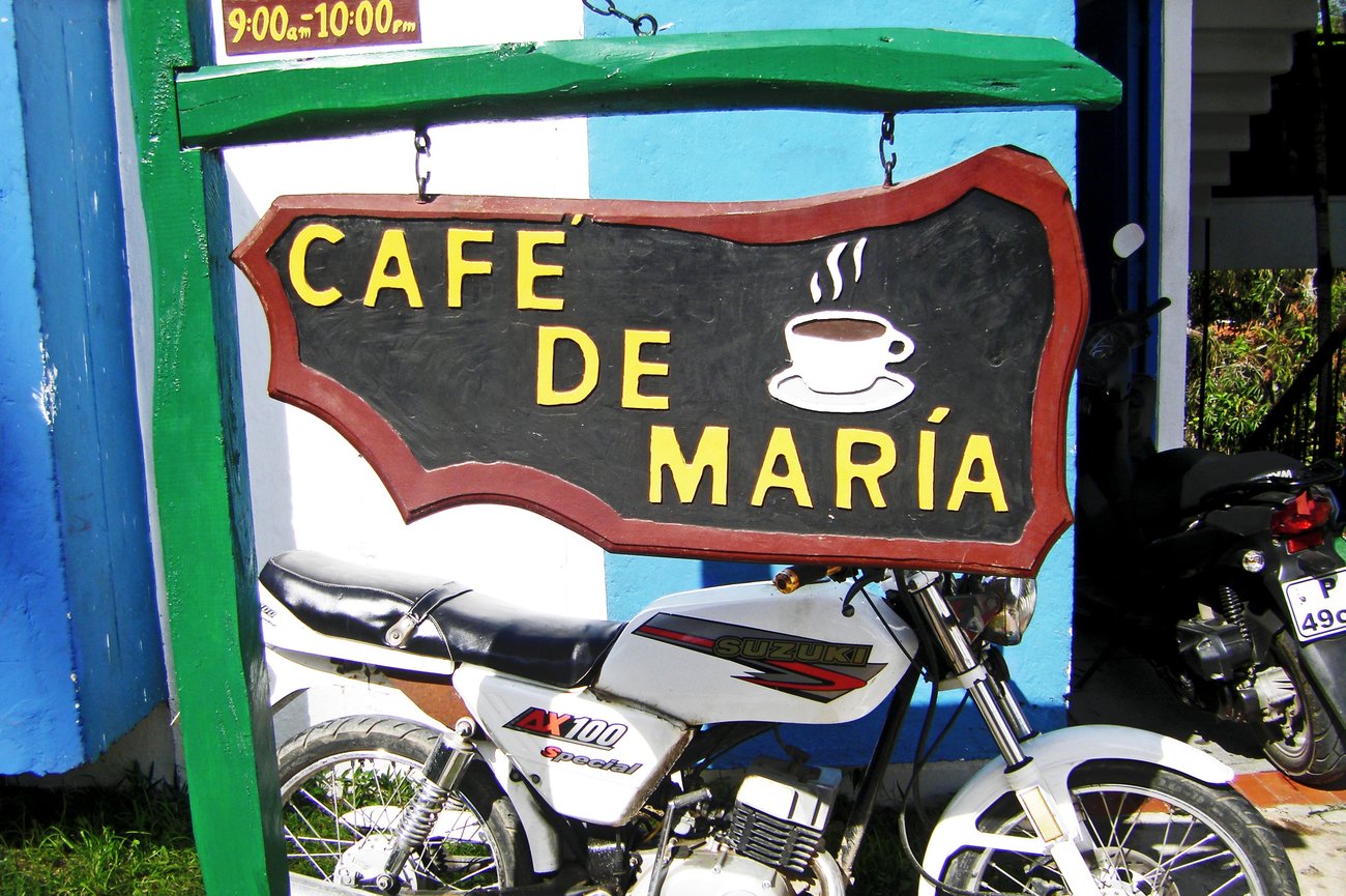 Schild mit Aufschrift "Cafe de Maria"